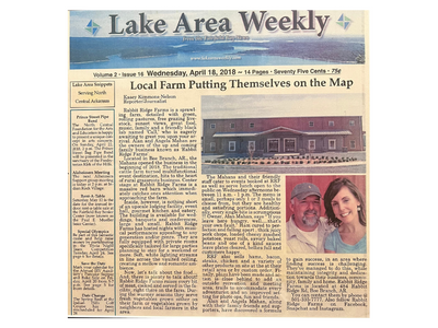 Lake Area Weekly newspaper front page with article and two small portrait photos