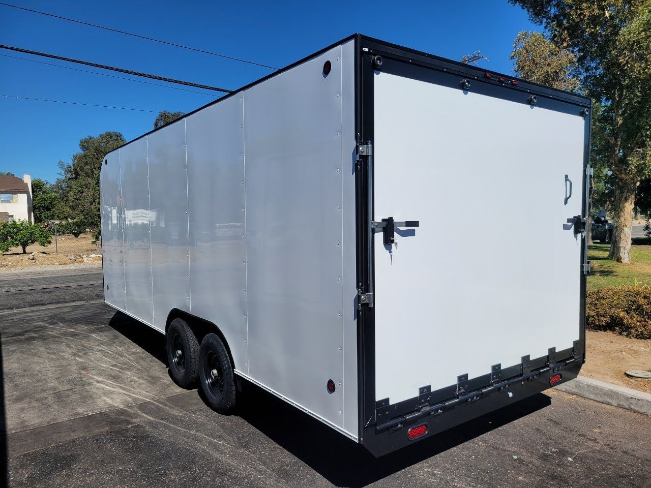 White Enclosed Trailer Rear Left Side View