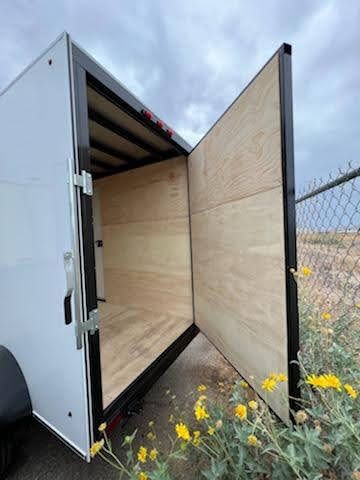 Short Enclosed Trailer With Slightly Opened Door