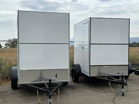 Parked Short White Enclosed Trailers