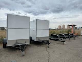 Short White Enclosed Trailers Front Left Side View