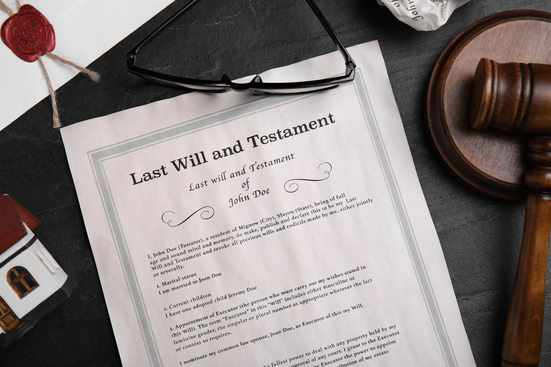 Last Will and Testament document with gavel, eyeglasses, and a wax seal.