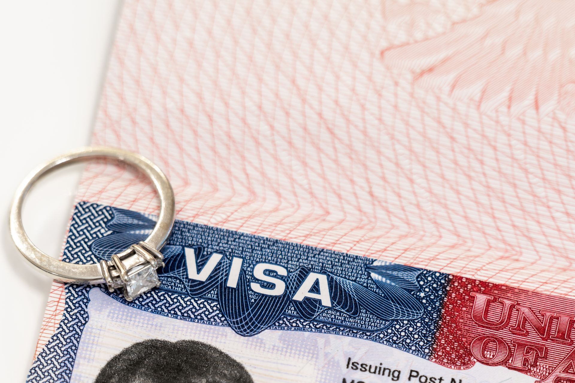 Engagement ring on a visa document, likely for international marriage or immigration.