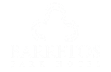 Logotipo do Barretos Park Hotel com uma forma branca em forma de cruz e texto.