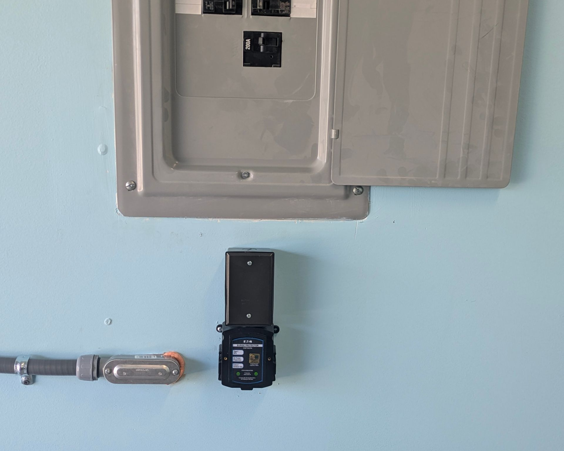 Whole house surge suppressor under electrical panel in Sunset beach nc