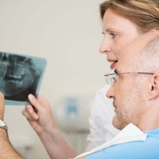 Dentists discussing X-ray