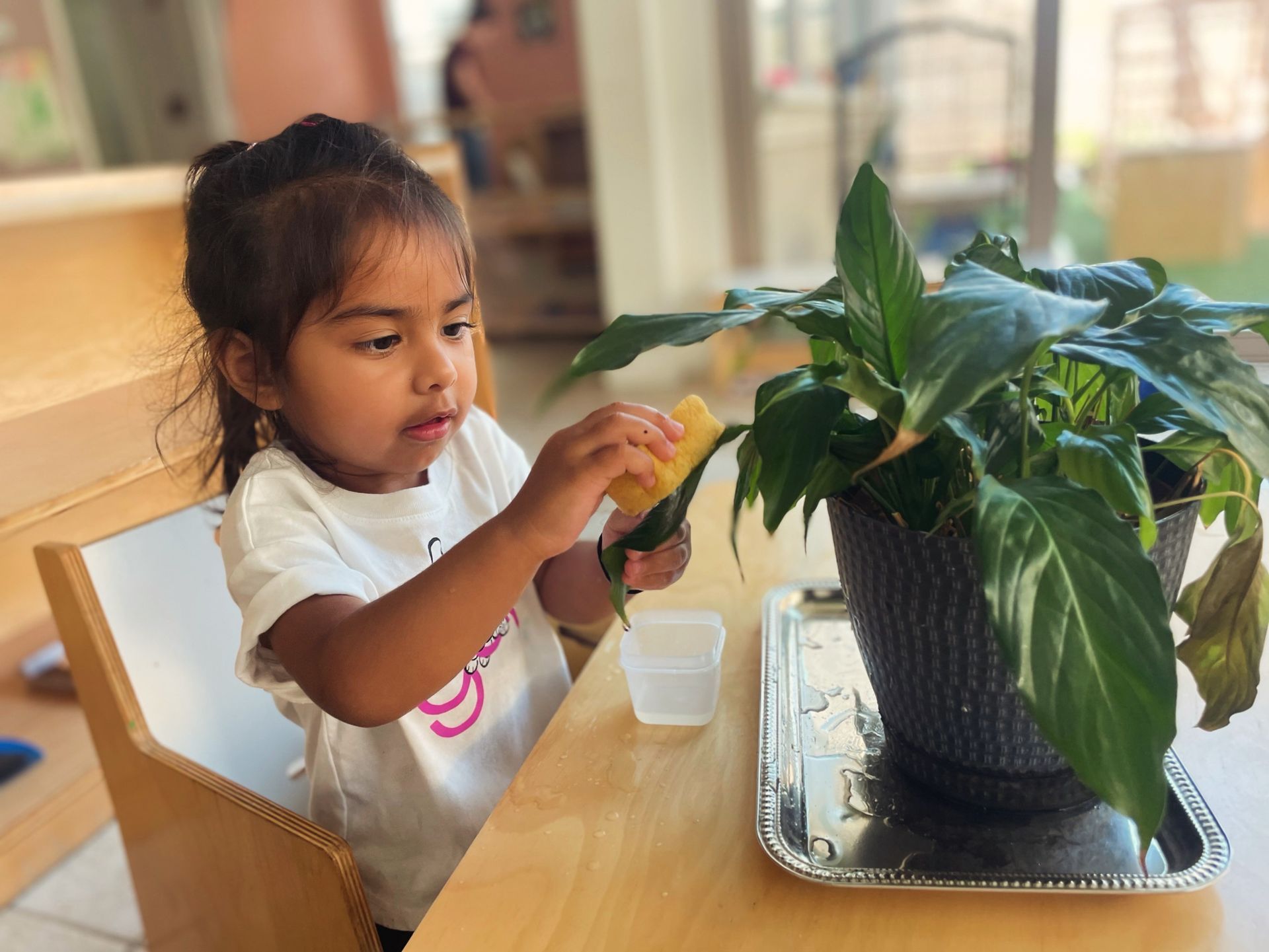 Montessori toddler doing some painting