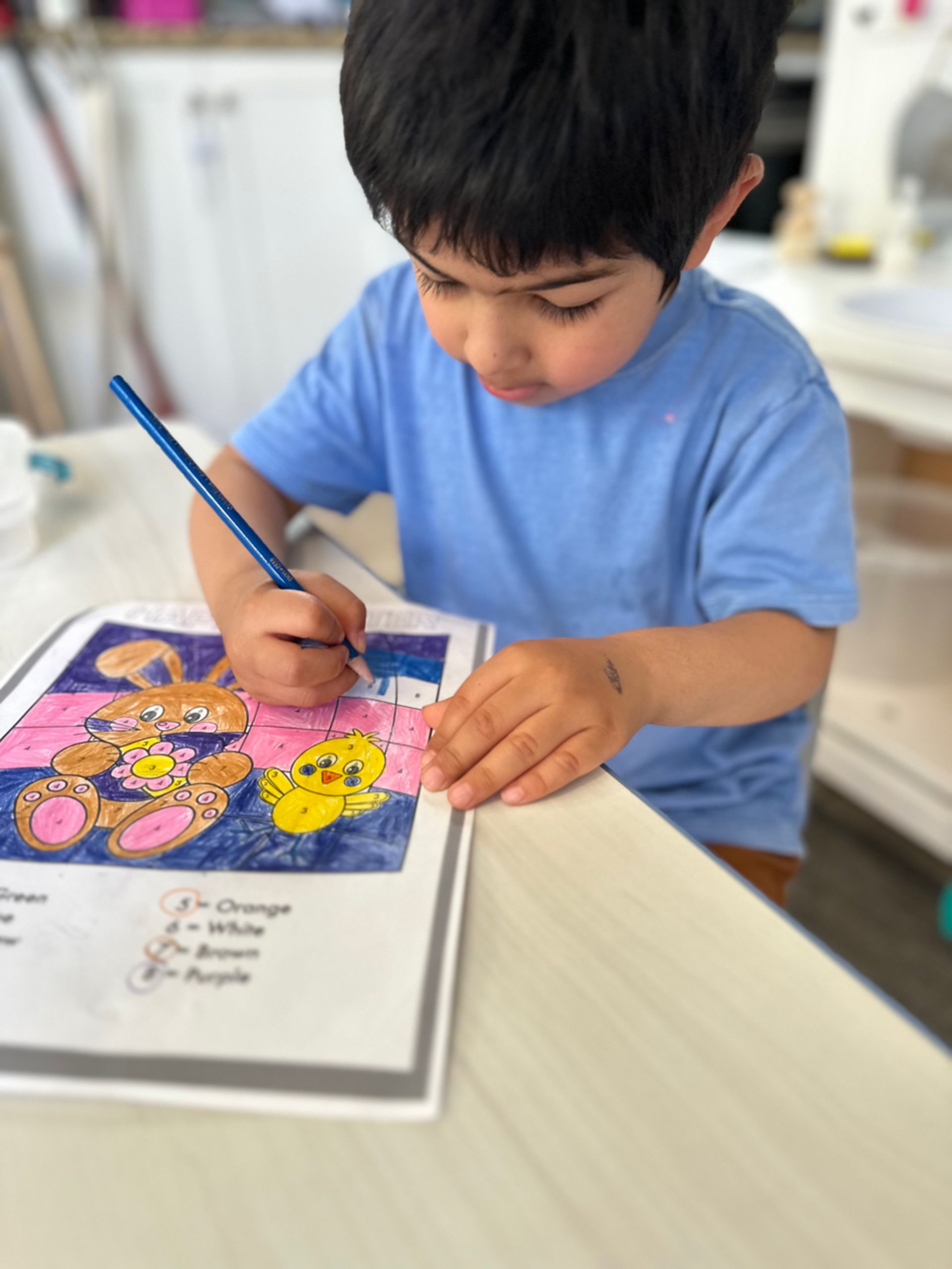 Montessori toddler doing some painting