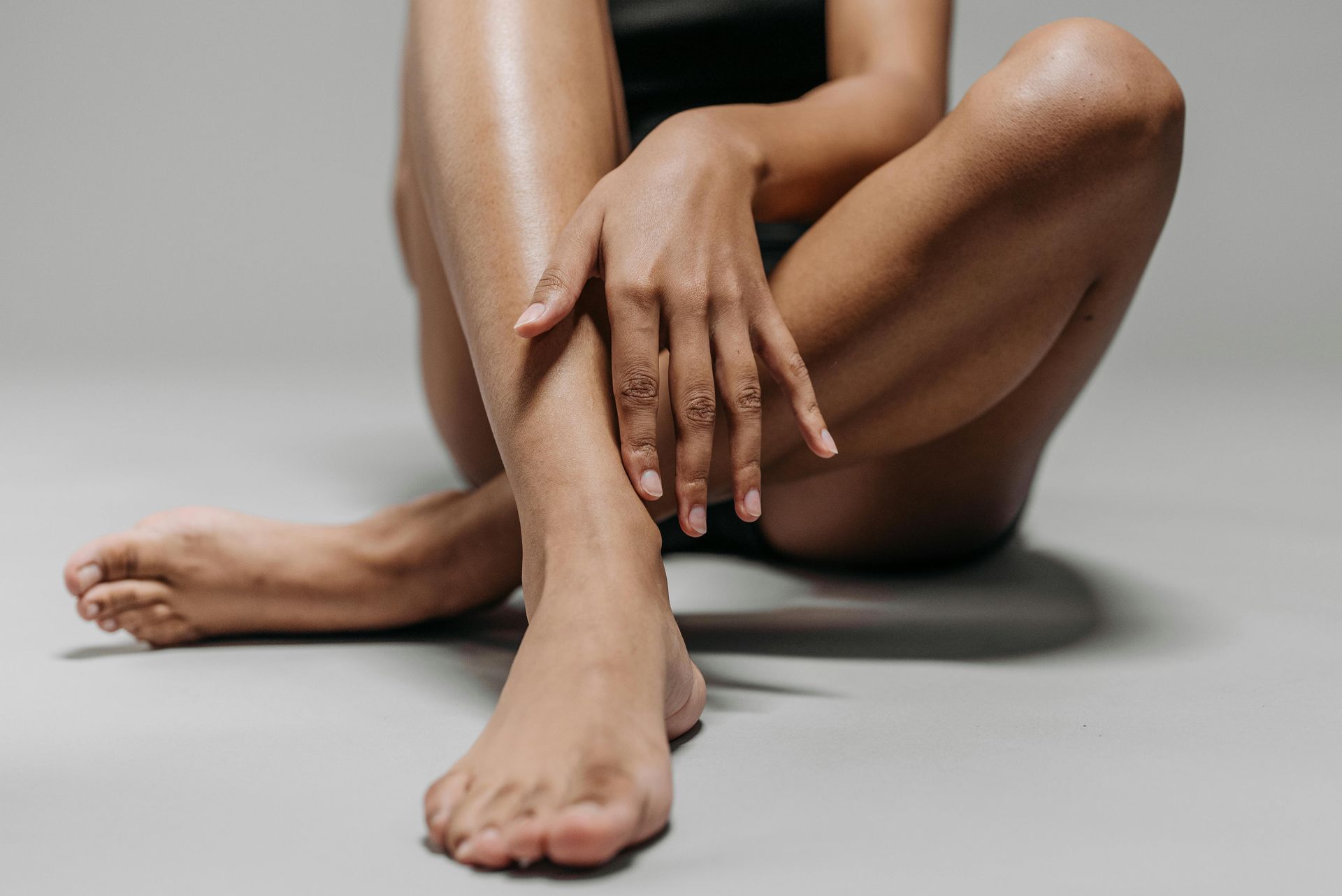 A patient with smooth legs and skin because of Laser Hair Removal at The Luxe Dose in Belmont, MA.