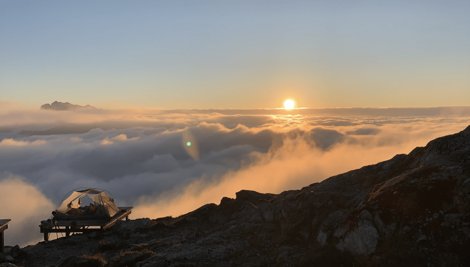 Sunrise, a tent and cloud inversion on the Panorama Ridge at Golden Ears mountain, BC, Canada