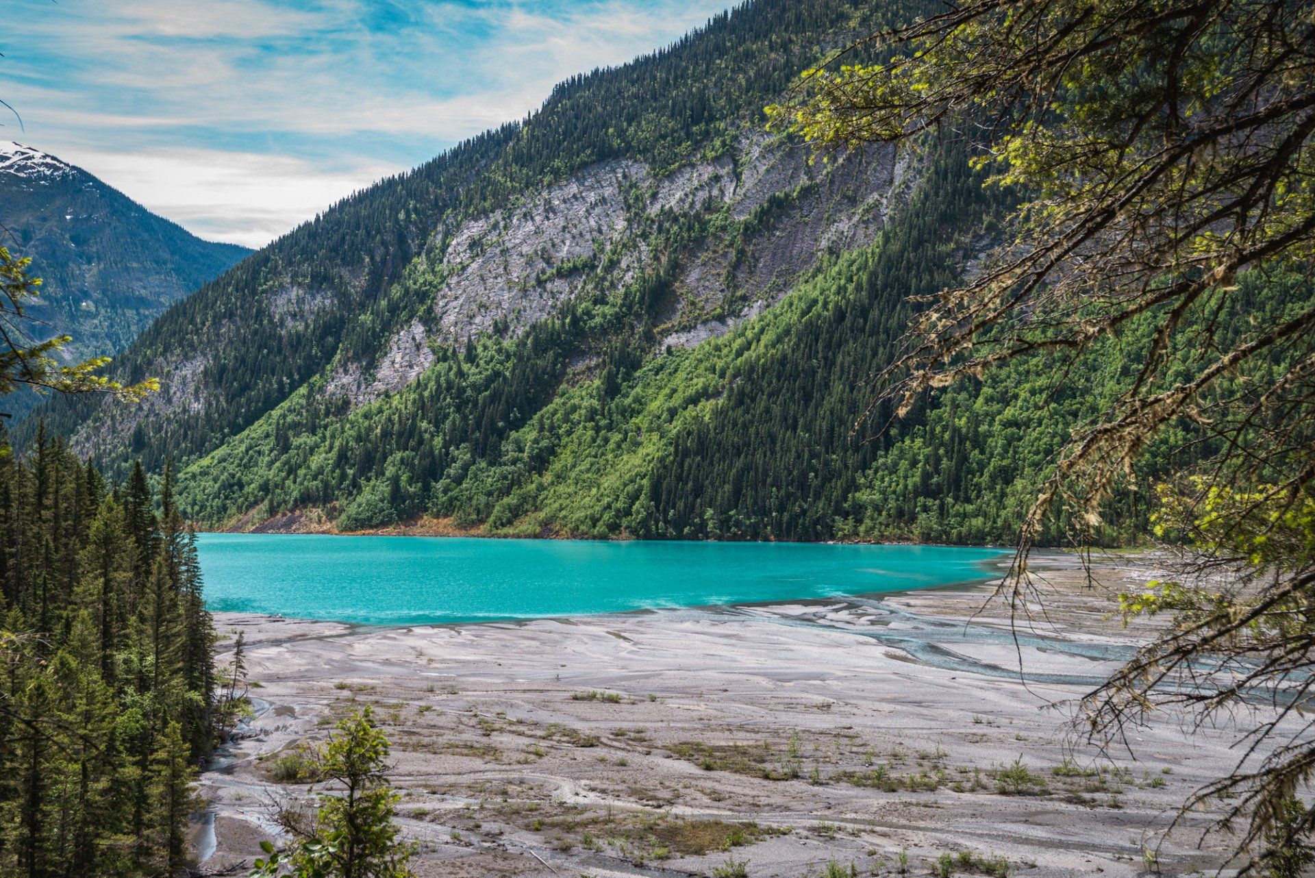 Kinney lake's delta, mt Robson park, BC, Canada. Turquoise lake and mountains touched with first rays of morning sun