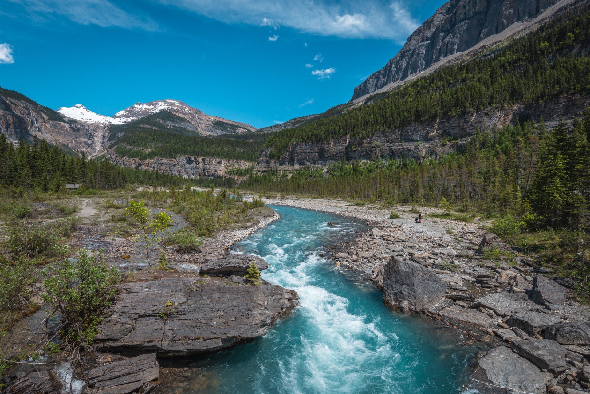 View near the Whitehorn camp, blue Berg river at mt Robson park, BC, Canada. Turquoise lake and mountains touched with first rays of morning sun