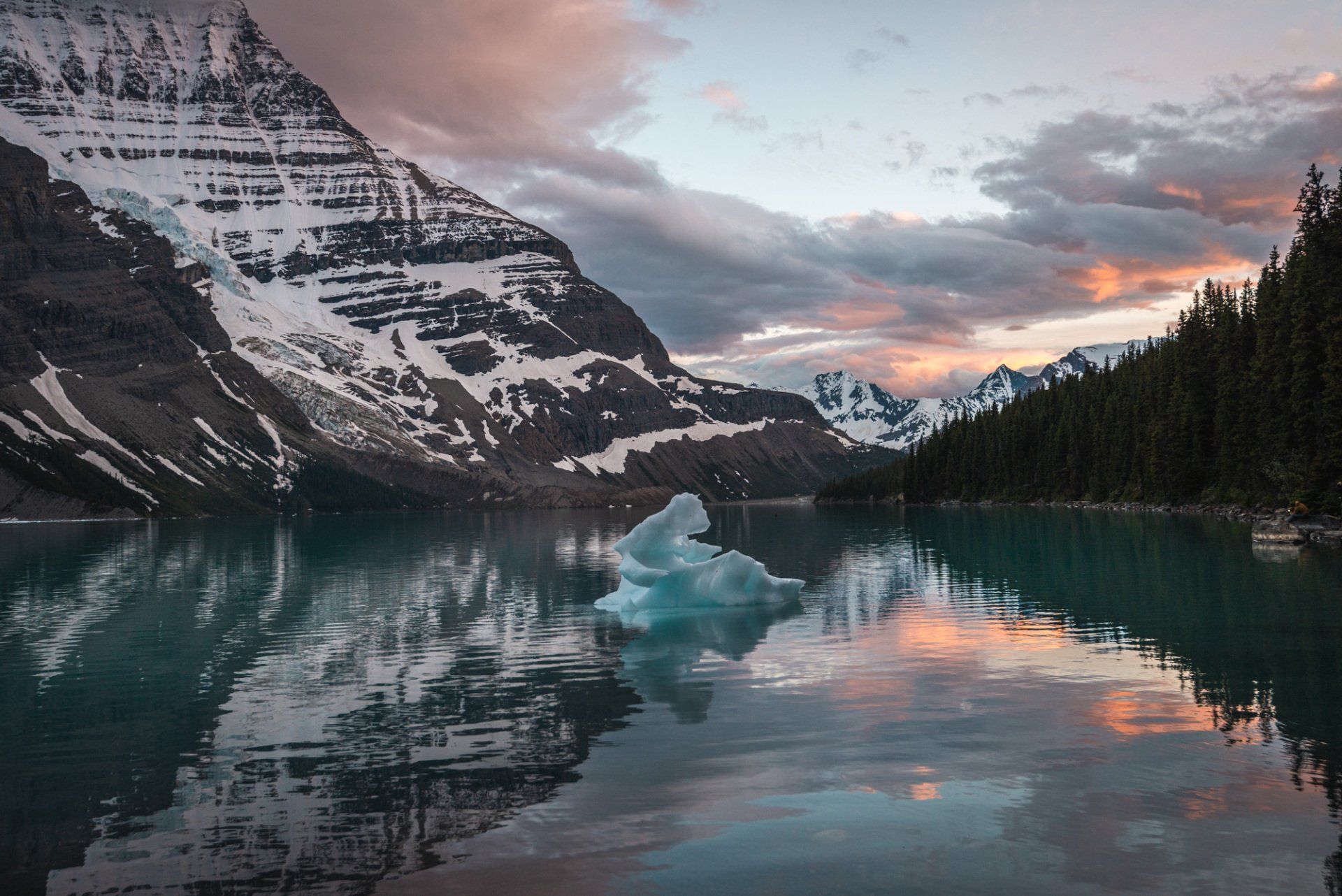 Sunset on Berg lake, mt Robson park, BC, Canada. Turquoise lake and mountains touched with first rays of morning sun