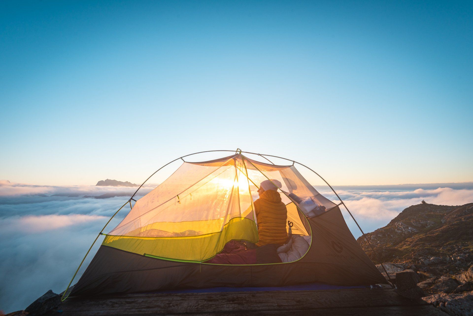 View of a tent, sunrise and cloud inversion on the Panorama Ridge at Golden Ears mountain, BC, Canada
