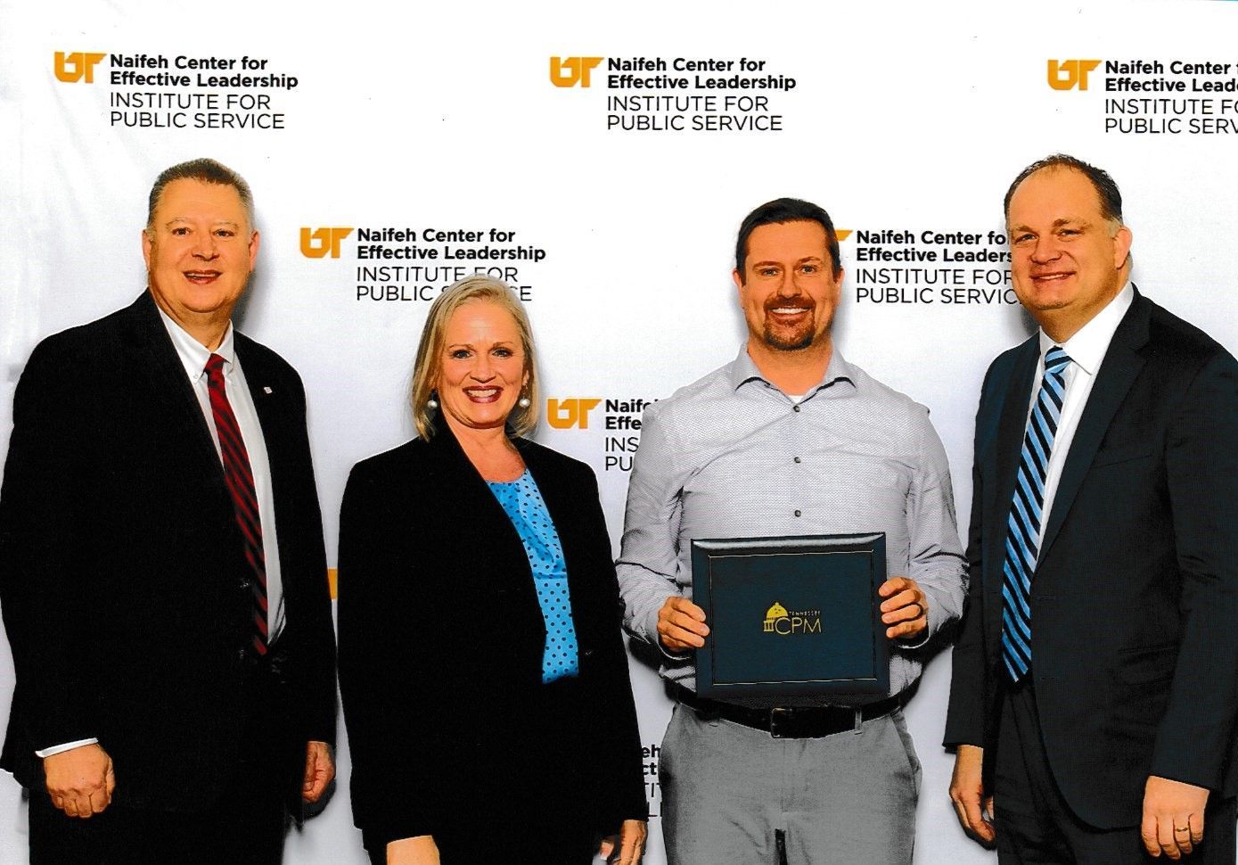 Planning and Zoning Director Jason Pilkinton receiving his Certified Public Manager certificate