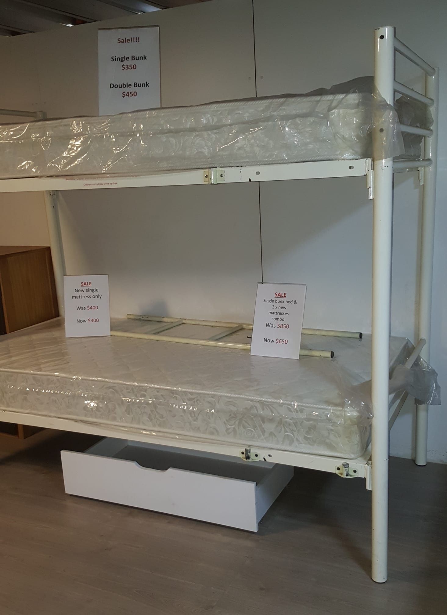 A Bunk Bed With a Mattress and a Drawer Underneath It — Anton's New & Used Furniture In Ciccone, NT