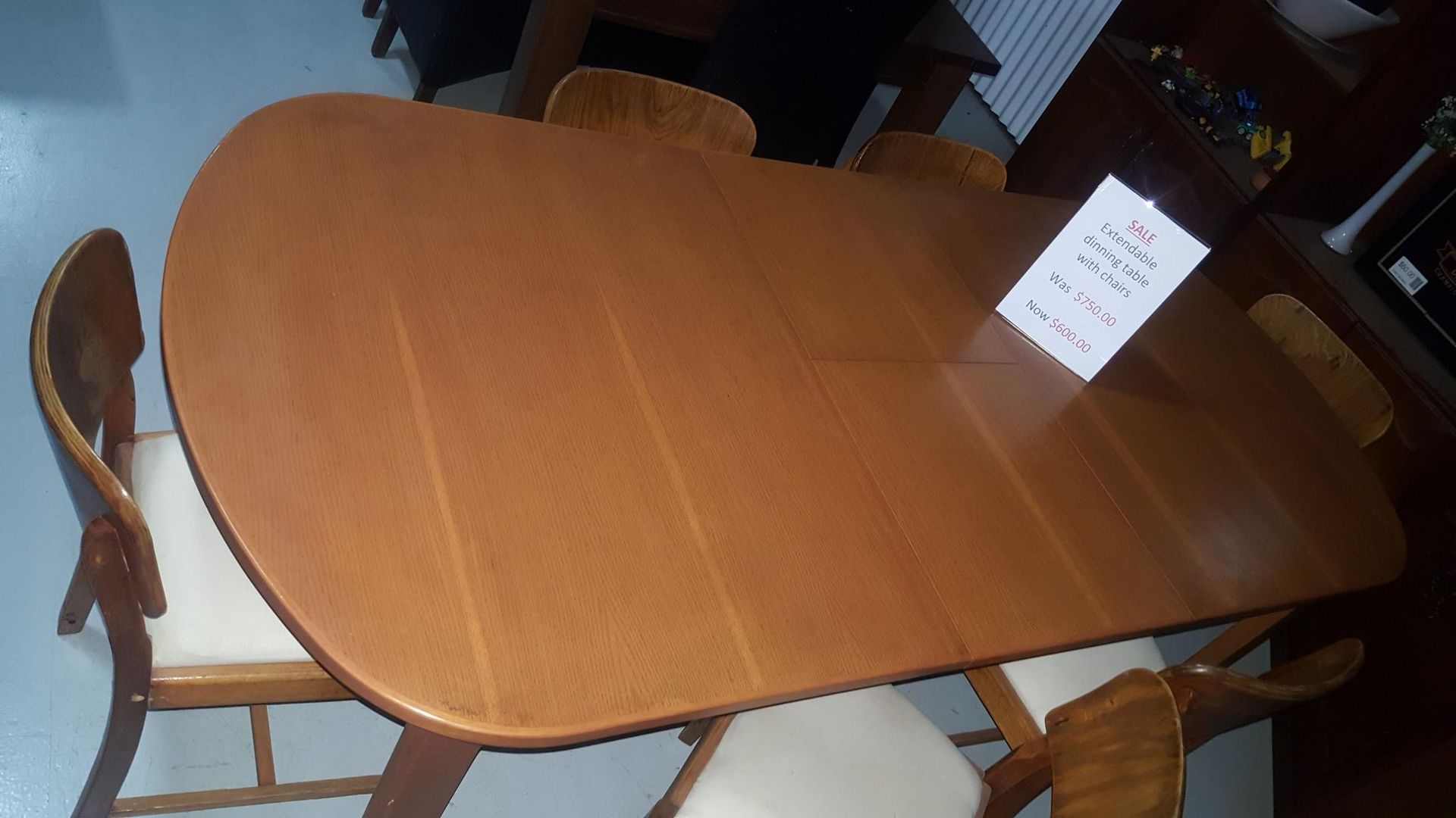 A Wooden Table With a Sign on It — Anton's New & Used Furniture In Ciccone, NT