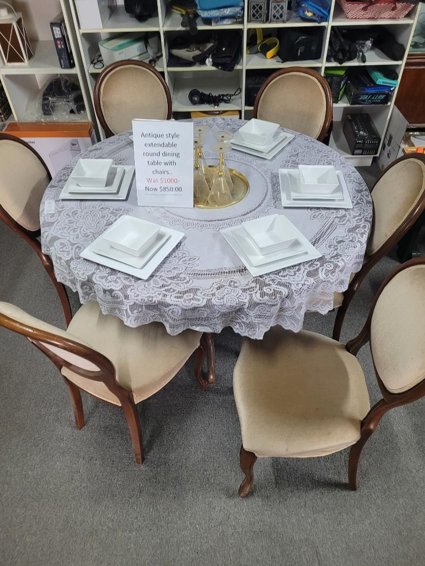 A Round Table With Plates , Bowls , and Glasses on It — Anton's New & Used Furniture In Ciccone, NT