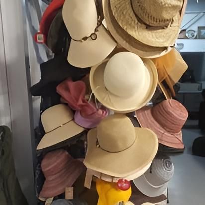 A Bunch Of Hats Are Stacked On Top Of Each Other — Anton's New & Used Furniture In Ciccone, NT