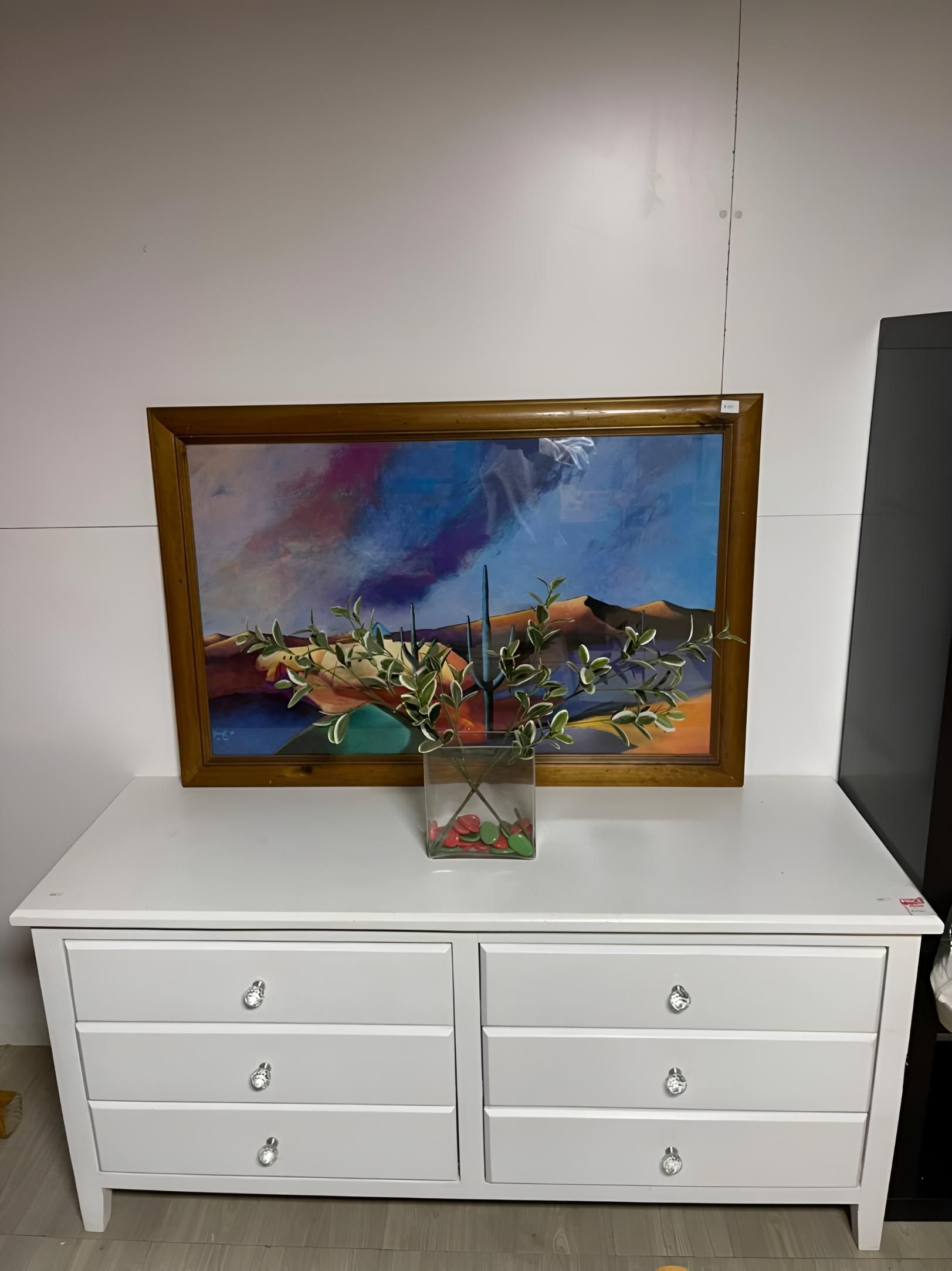 A White Dresser With Drawers And A Painting On Top Of It — Anton's New & Used Furniture In Ciccone, NT