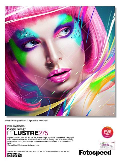A poster of a woman with pink hair and colorful makeup