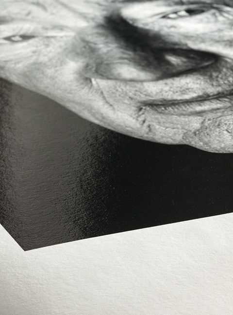 A close up of a black and white photo of a woman 's face.
