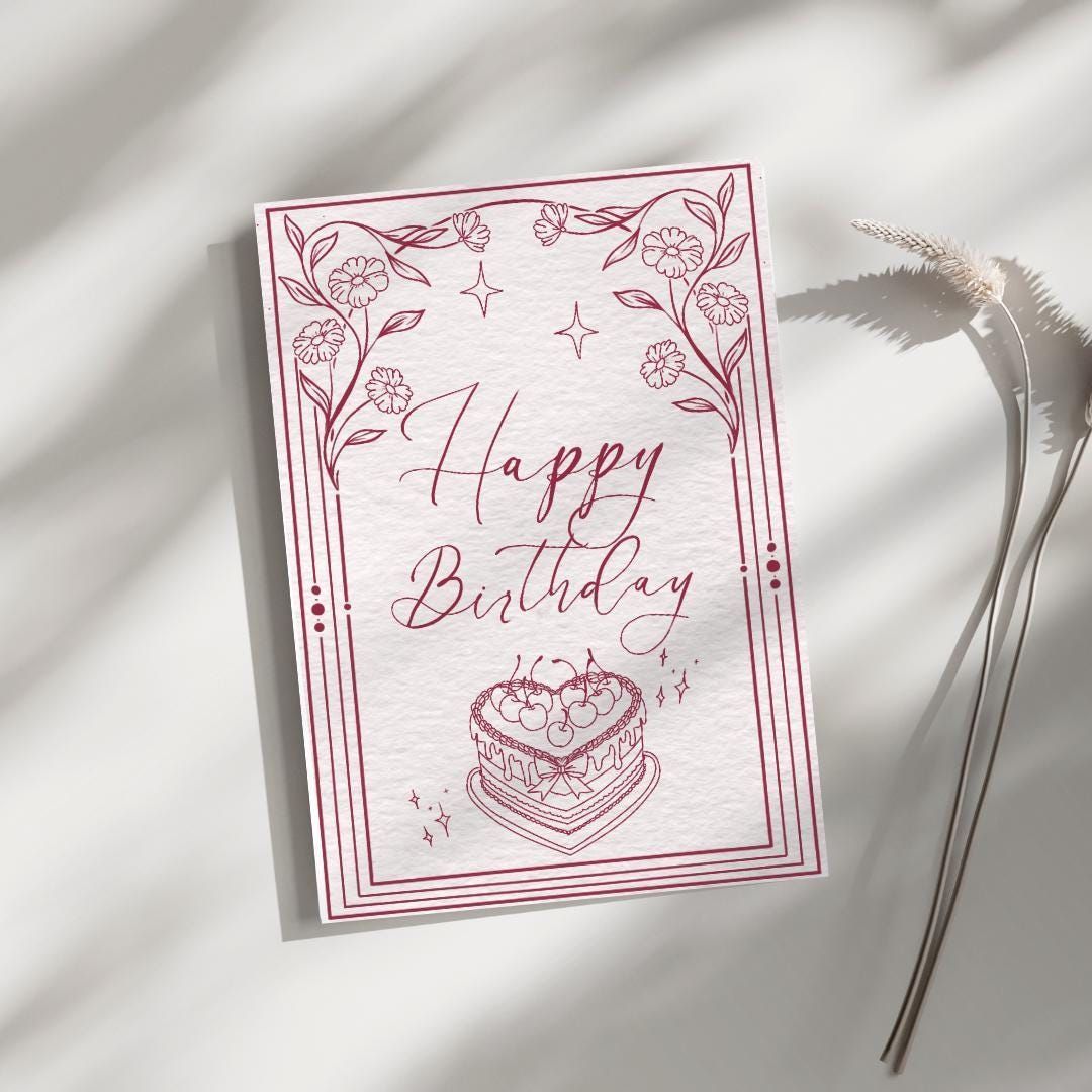 A bunch of cards and envelopes on a table with a plant and pencils