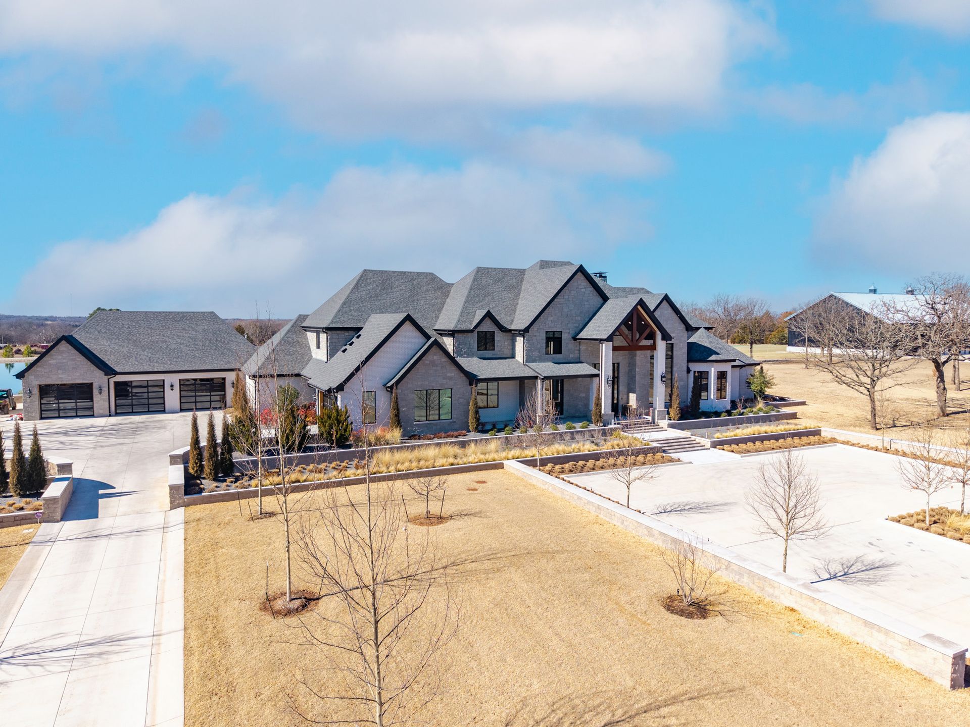 Two-story building with a covered porch. Sign says, 