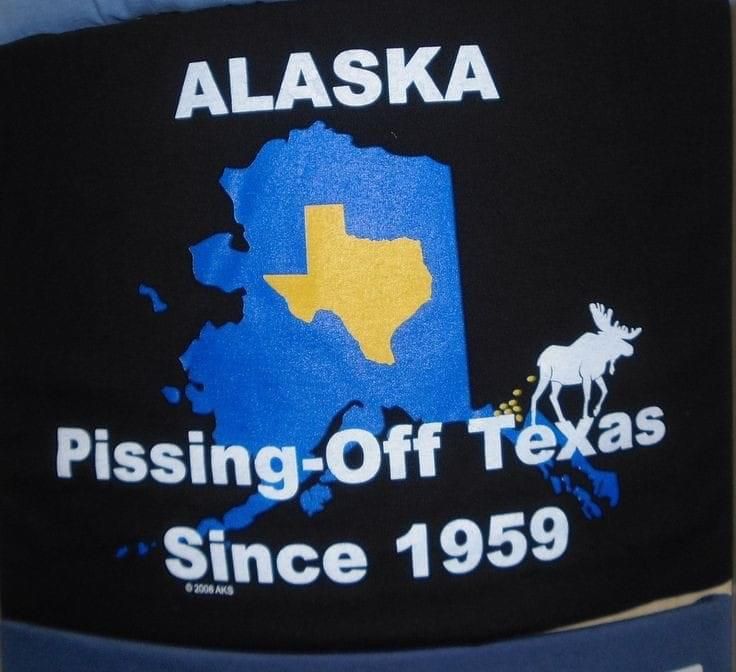 A black shirt with alaska pissing off texas since 1959. 