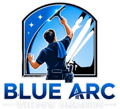 Blue Arc window cleaning logo with a worker squeegeeing a window under a blue sky