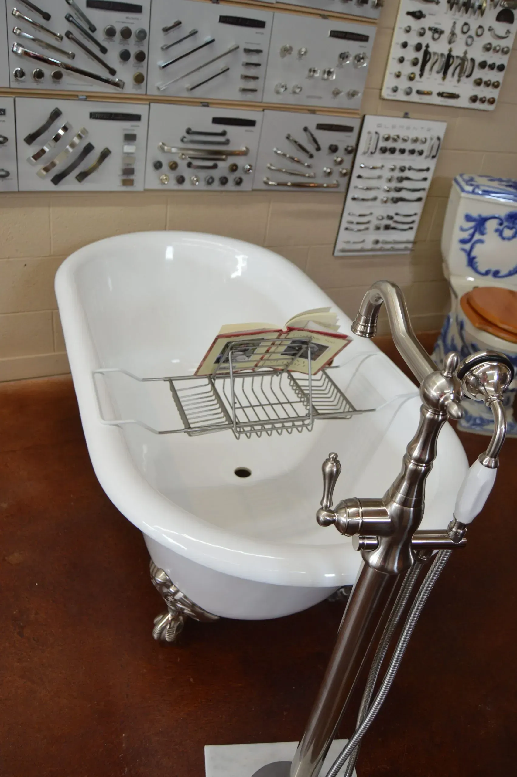 A bathtub with a book on top of it