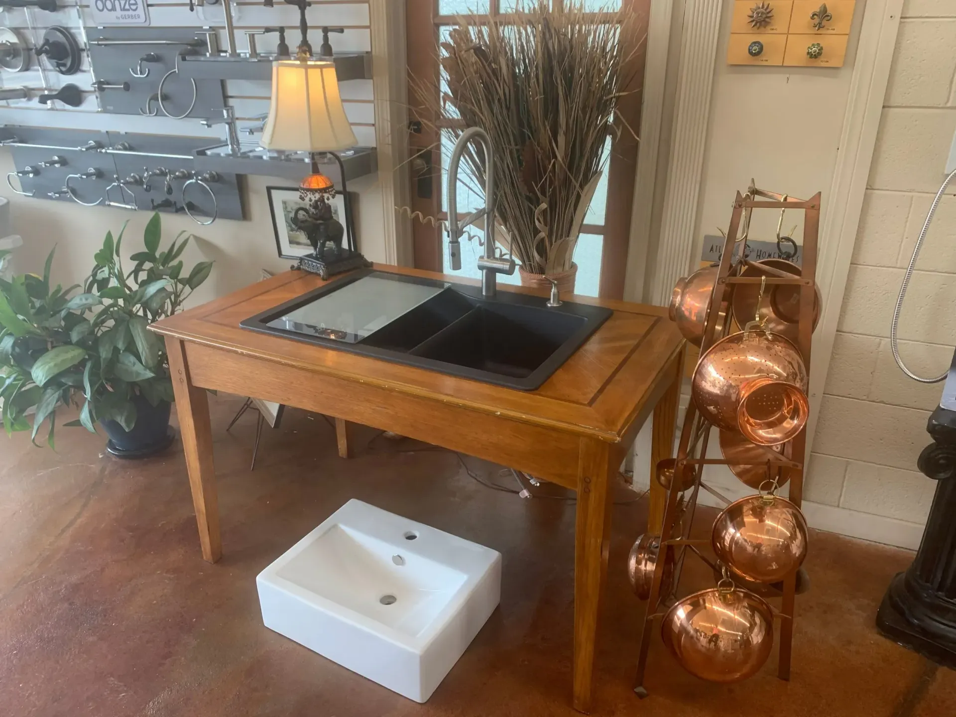 A wooden table with a sink on top of it in a room.
