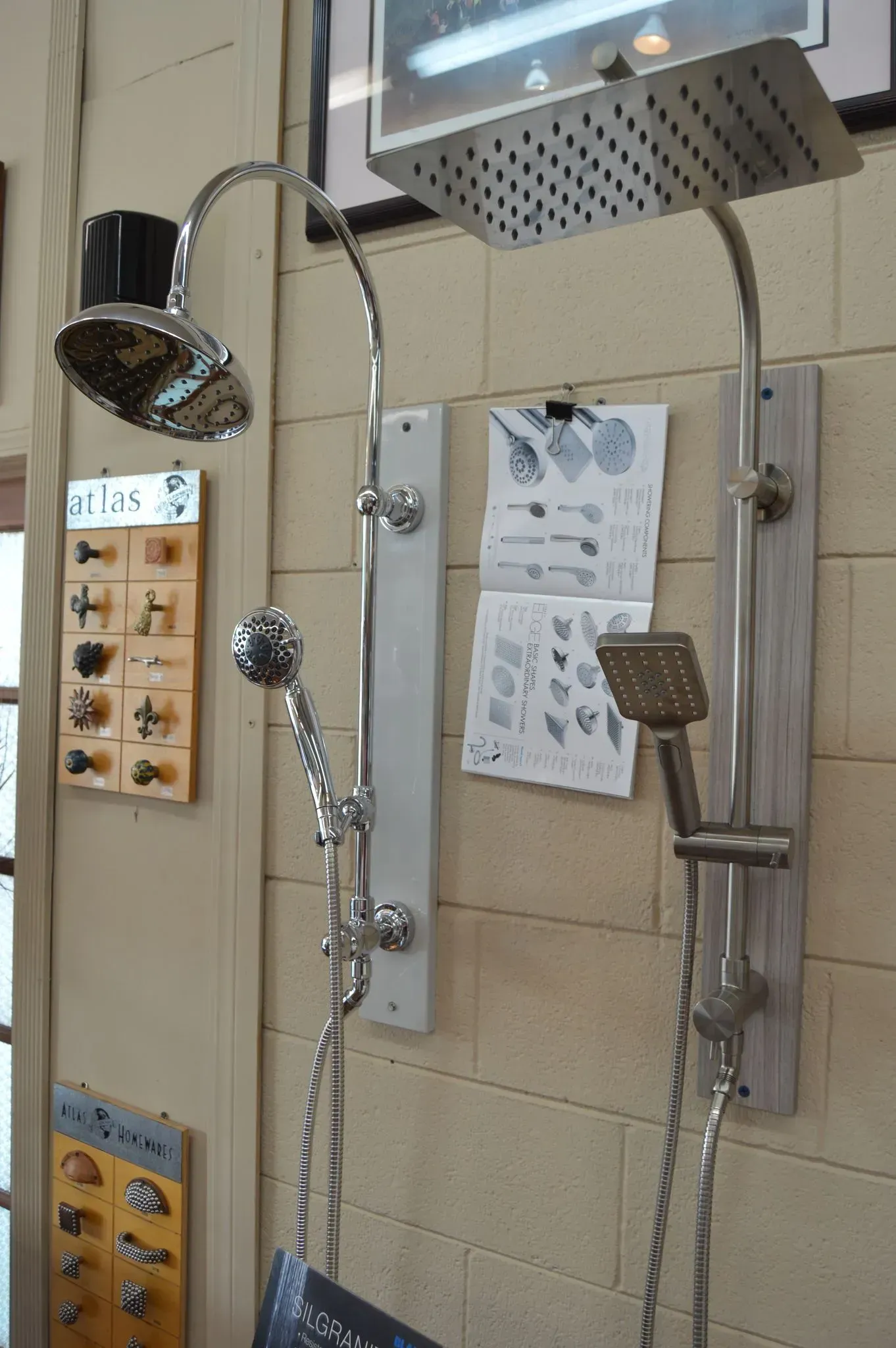A shower head is hanging on a wall in a bathroom