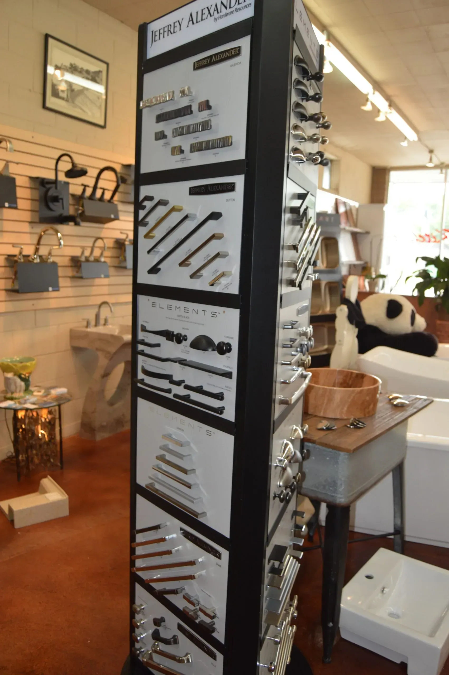 A display of handles and knobs in a store