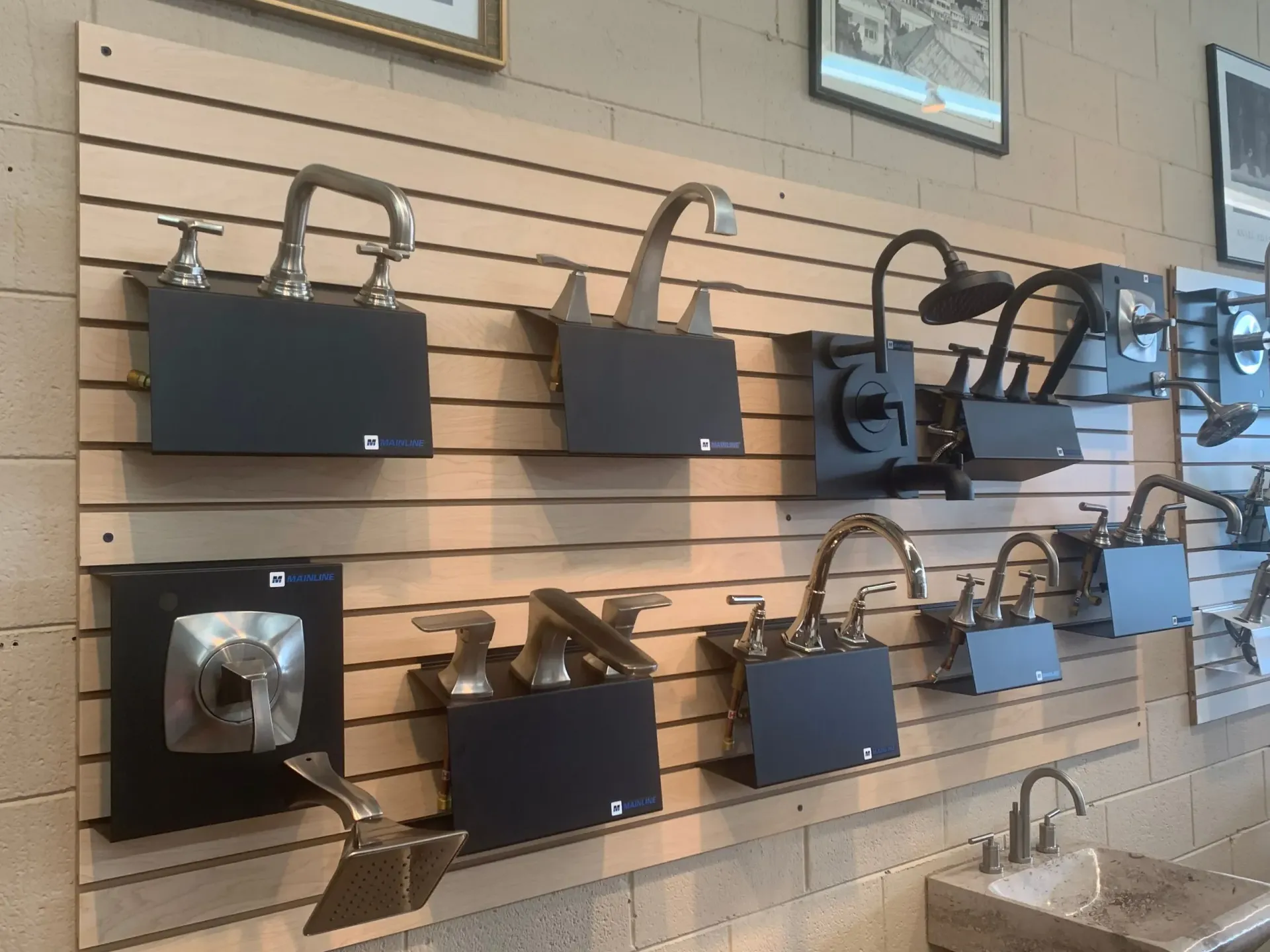 A wall with a bunch of faucets on it