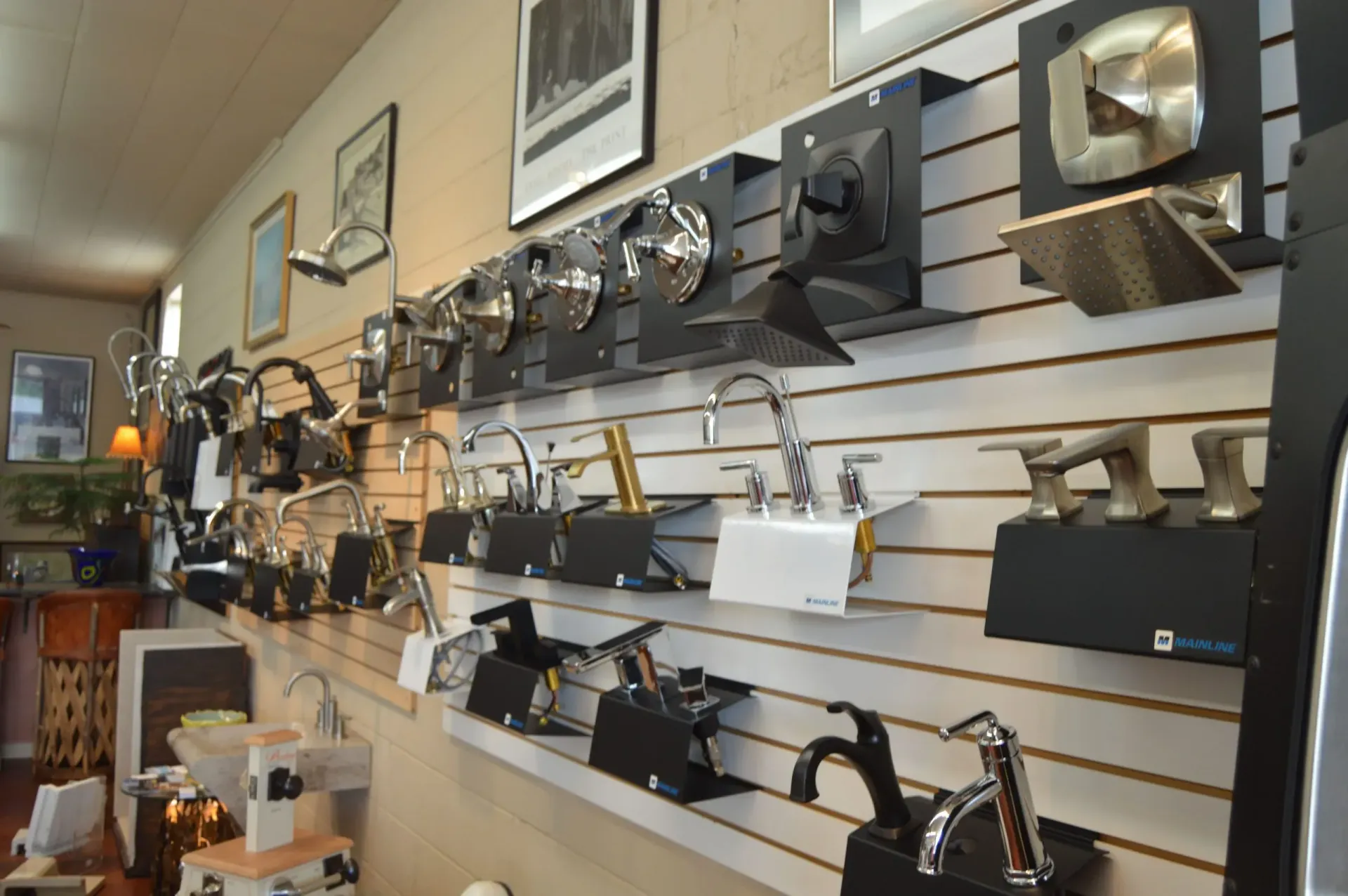 A wall with a lot of faucets on it