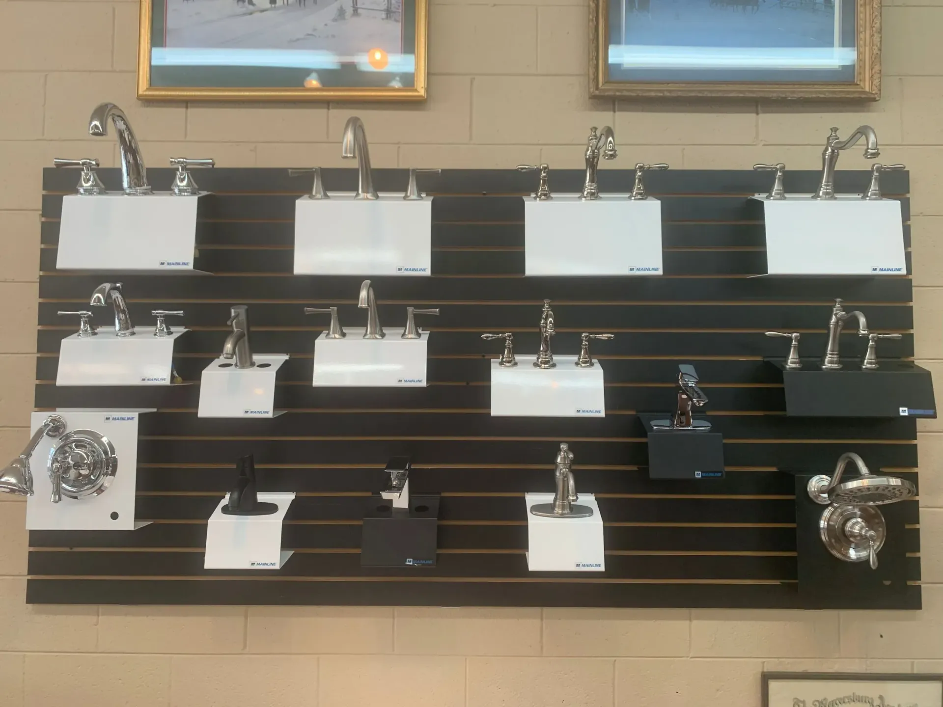 A wall with a bunch of faucets on it