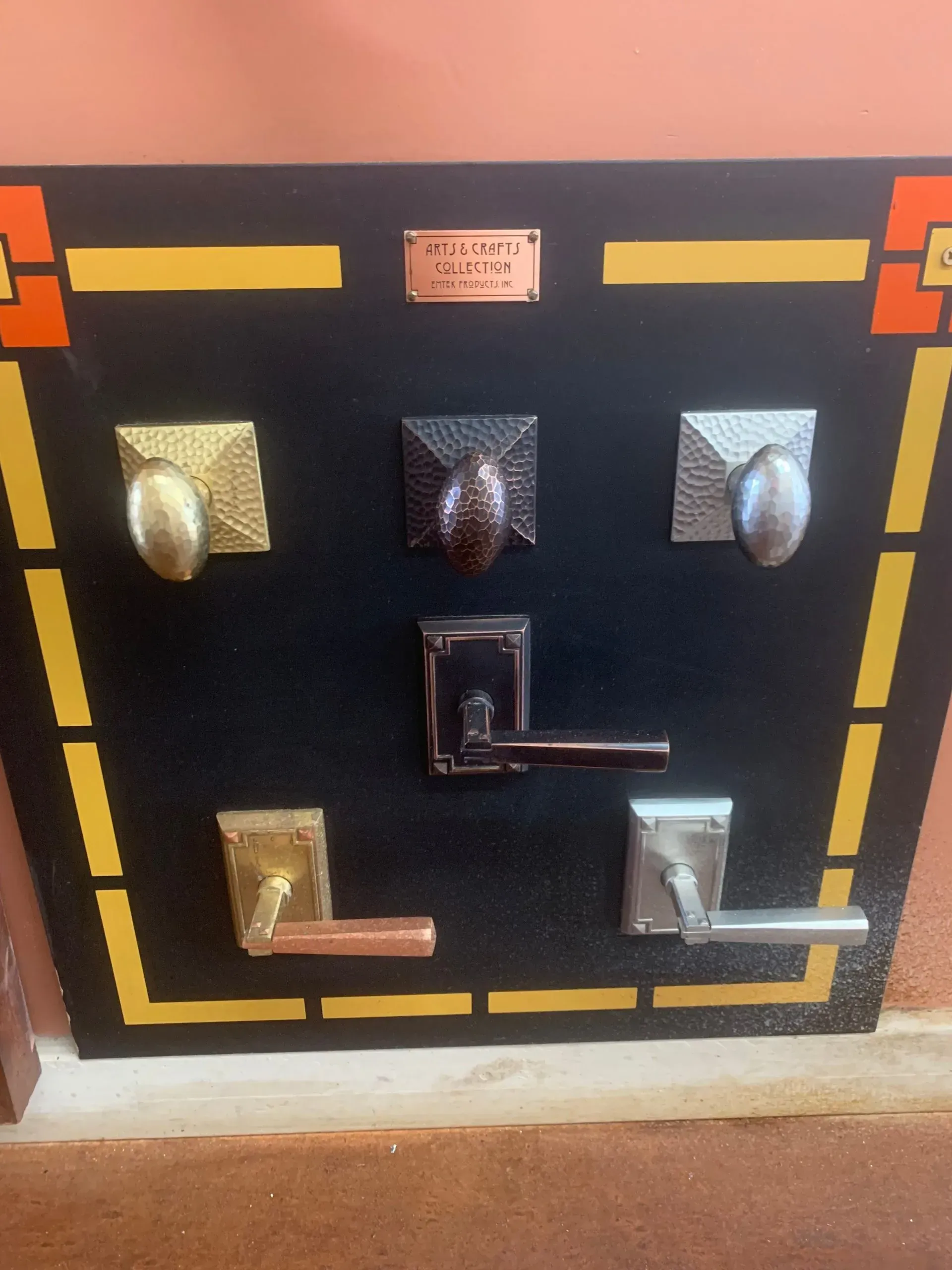 A display of different types of door handles and knobs