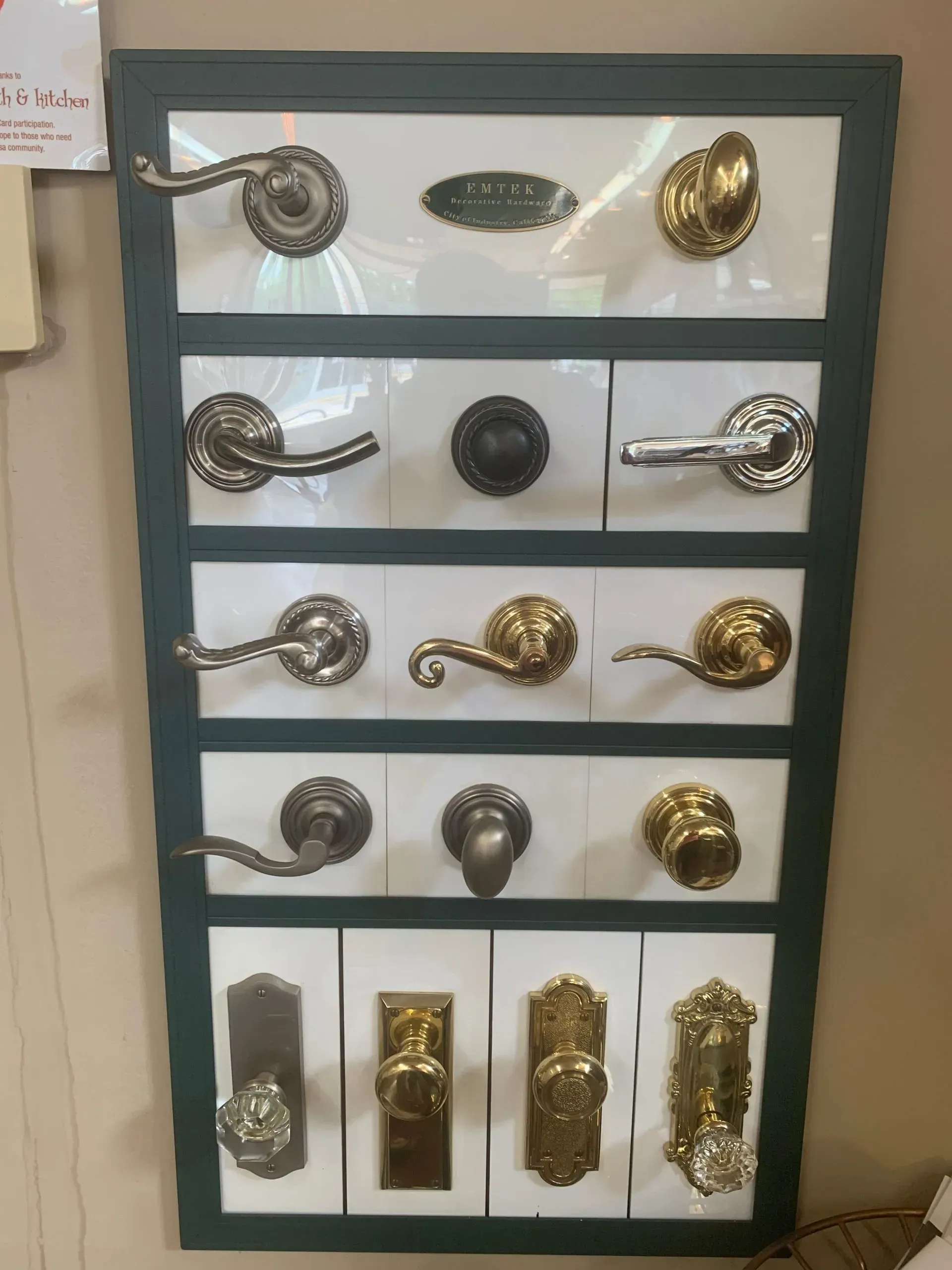 A display of different types of door handles and knobs