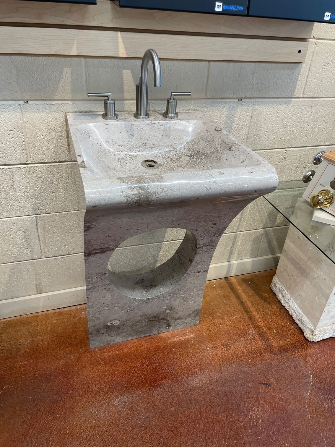 A bathroom sink with a hole in the middle of it.