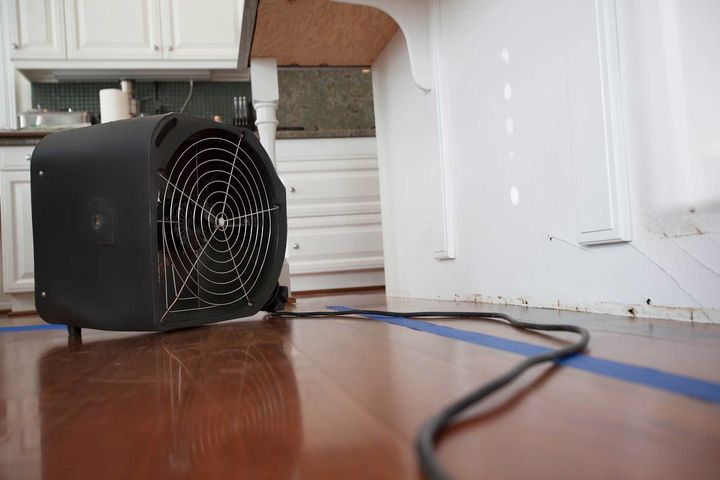 Industrial Fan For Water Damage In Kitchen
