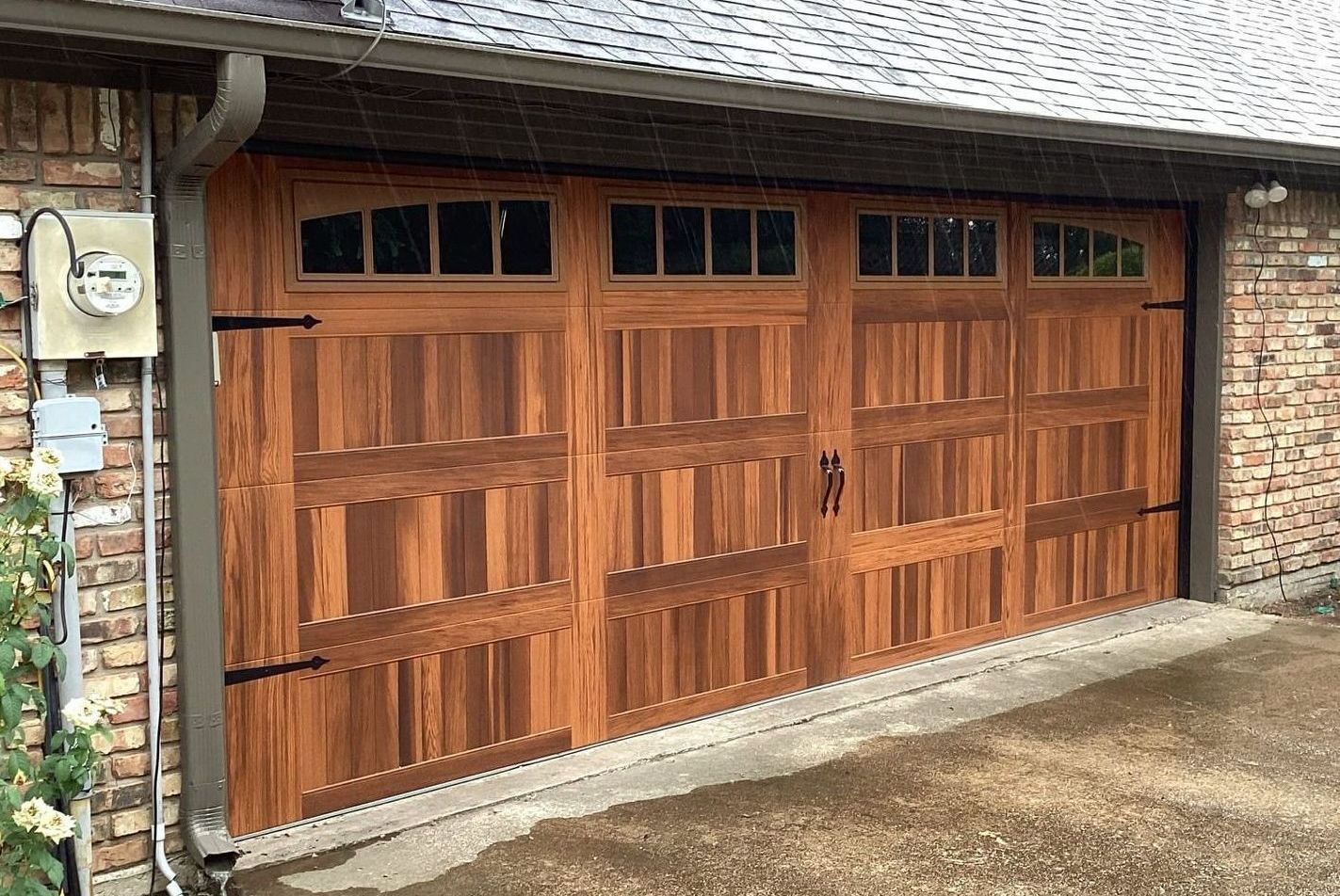 Wooden garage door with windows, brick exterior, and a power meter.
