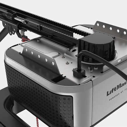 Close-up of a LiftMaster garage door opener, with a black belt, motor, and silver housing.