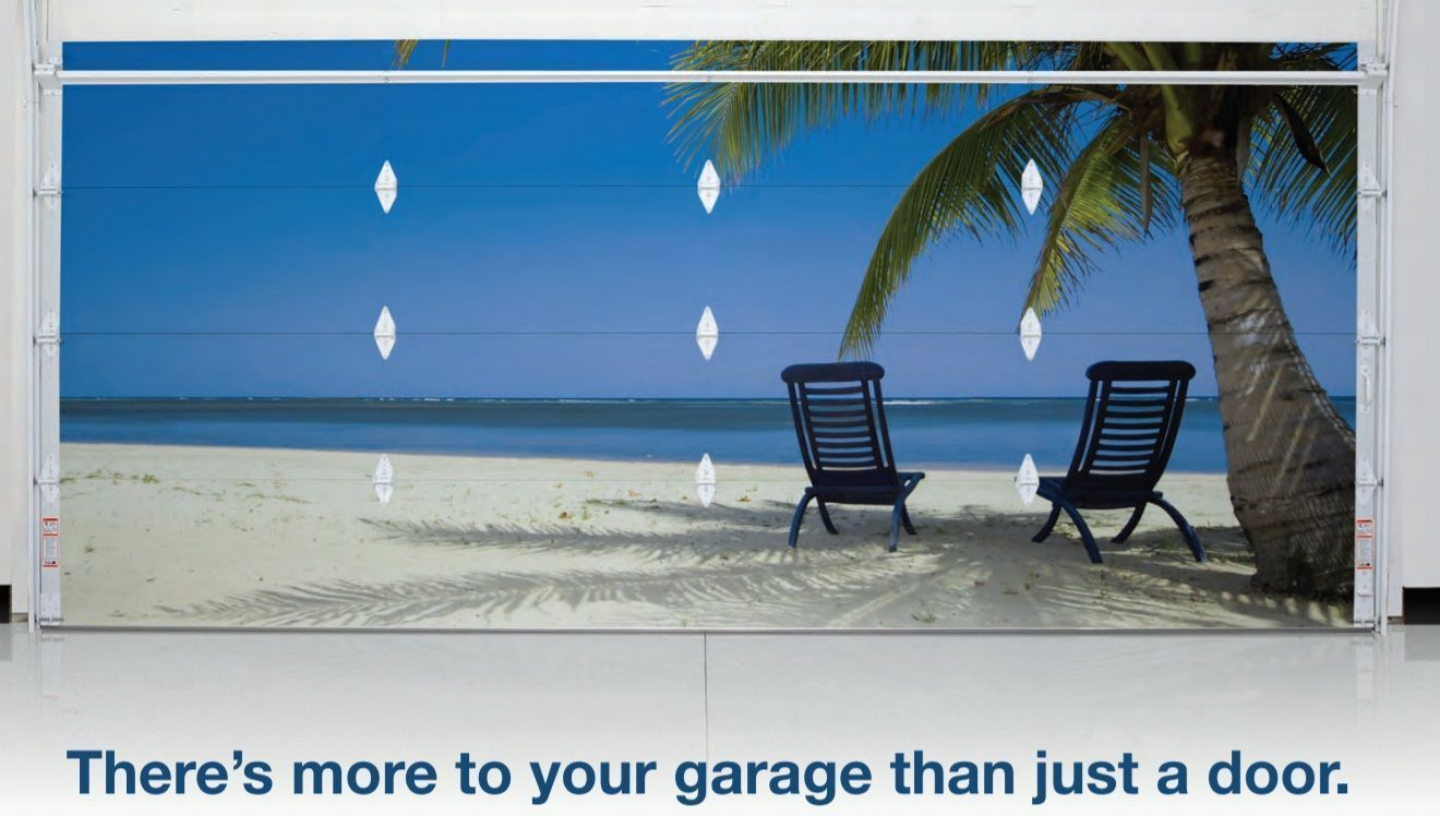 Garage door with beach scene graphic: two chairs on a sandy beach, palm tree, ocean, blue sky. Garage door with beach scene graphic: two chairs on a sandy beach, palm tree, ocean, blue sky.
