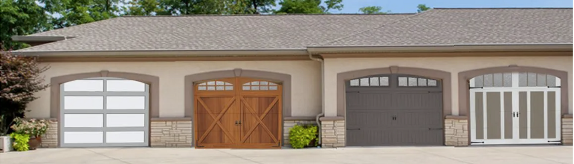 Four different garage doors on a beige building with a gray roof. Four different garage doors on a beige building with a gray roof.