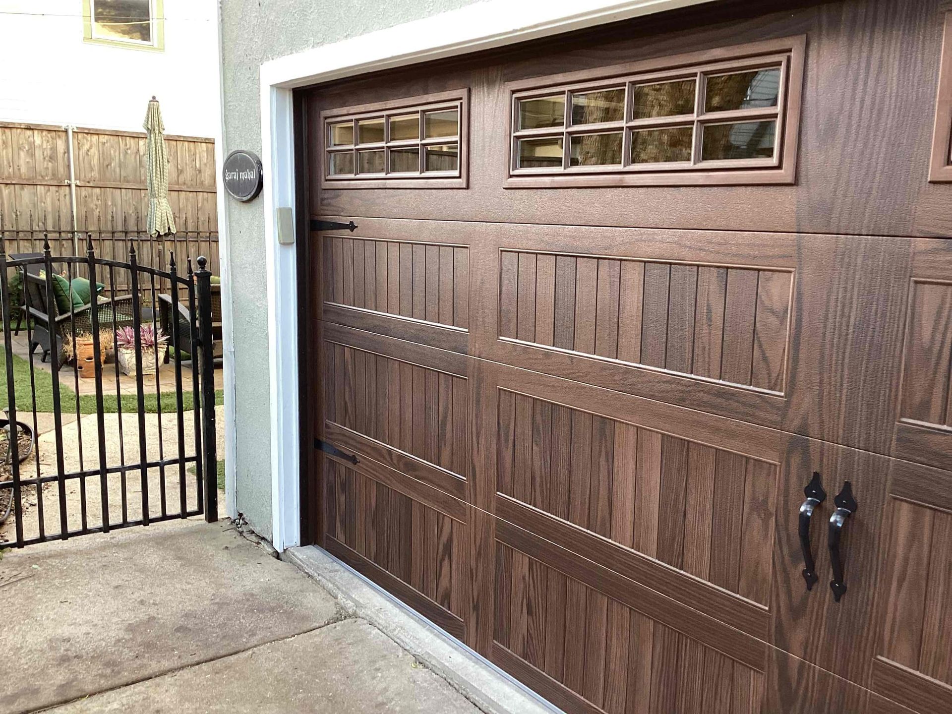 A modern garage door being installed.