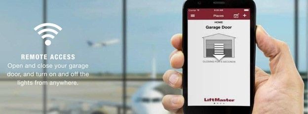A person holding a phone showing a garage door app. A plane flies outside the window.
