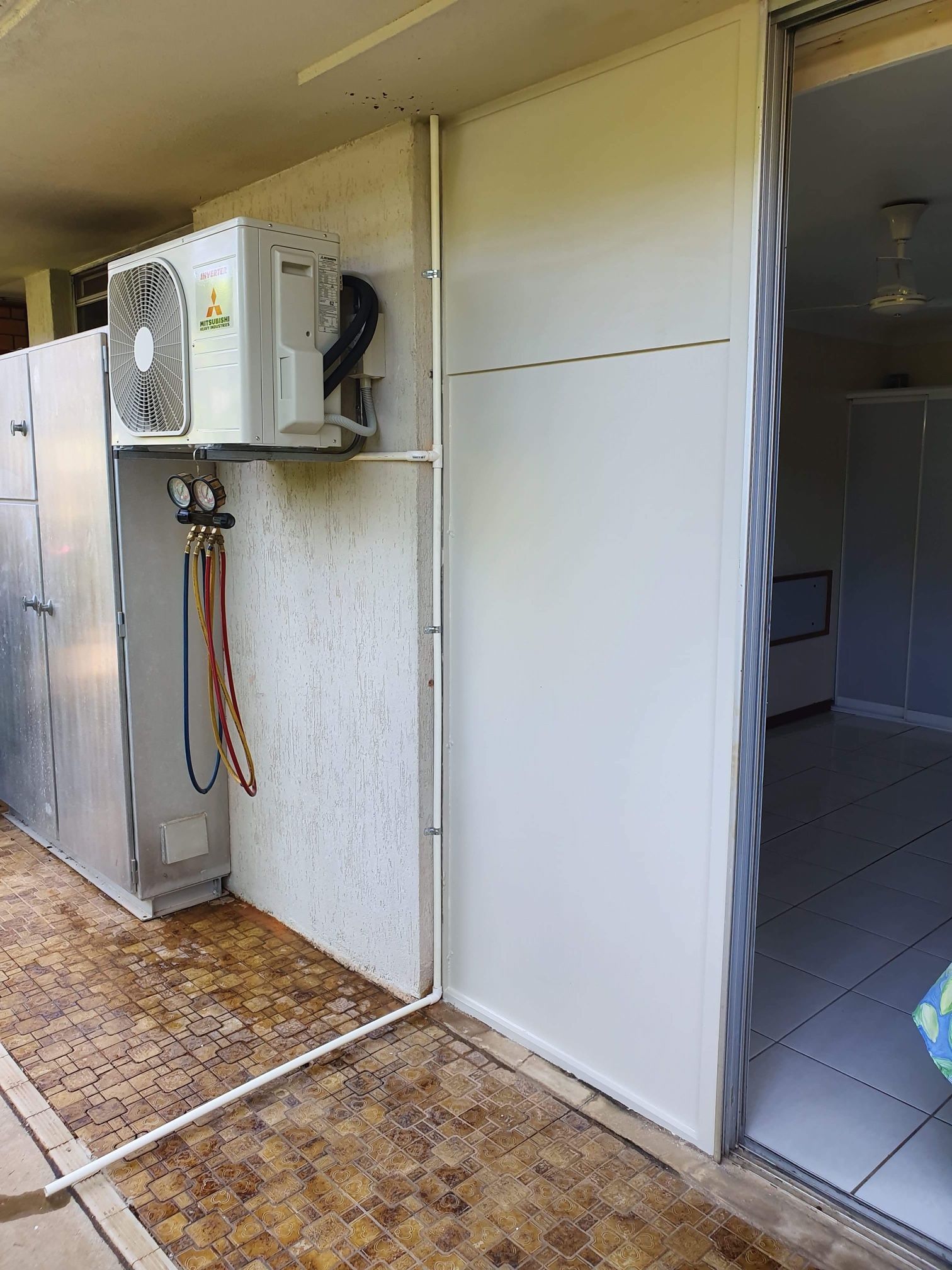 An Outdoor View With an Air Conditioner — Don Hall Air Conditioning & Electrical in Smithfield, QLD