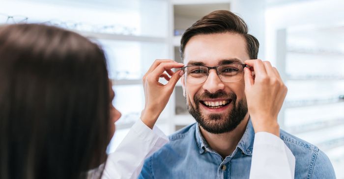 Doctor Helping Patient Trying Glasses — Chandler, AZ — Sonoran Desert Eye Center