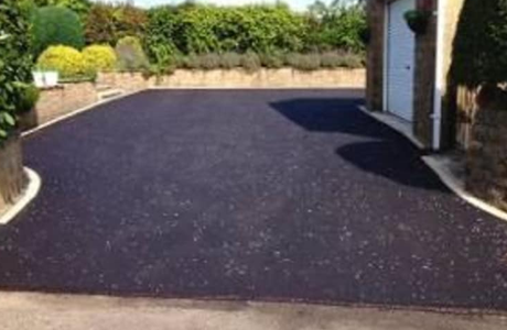 asphalt driveway on the entrance of the house